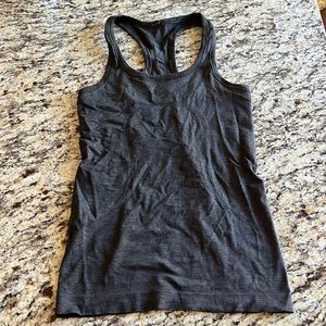 Dark green Lululemon razor back tank.